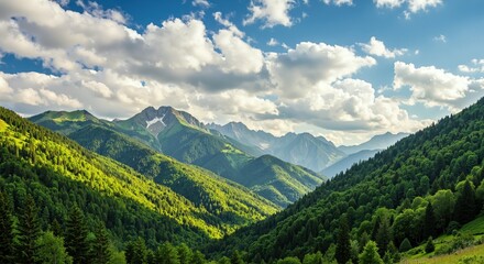 Fototapeta premium Majestic mountains against a bright, blue sky in a lush valley 