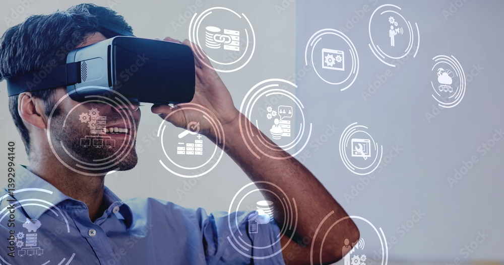 Poster digital composite of businessman using vr headset with digitally animated icons popping up into the