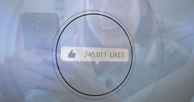 Image of digital interface thumbs up with growing numbers on white speech bubble over woman using sm