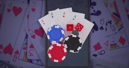 Image of casino chips, dice and playing cards over smartphone