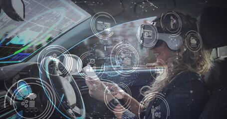 Image of information displays with woman in vr headset using smartphone in self driving car