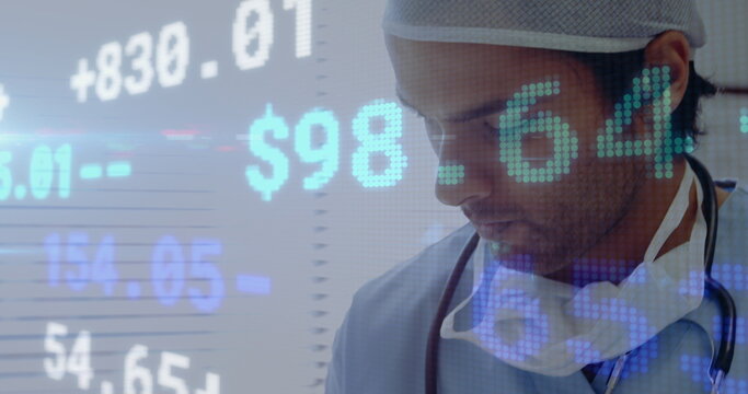 Stock market data processing against male surgeon reading medical reports - Powered by Adobe