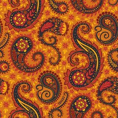 Floral paisley seamless pattern on orange background. Intricate eastern vintage wallpaper. Bohemian textile design.