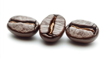 Obraz premium Three roasted coffee beans isolated on white background.