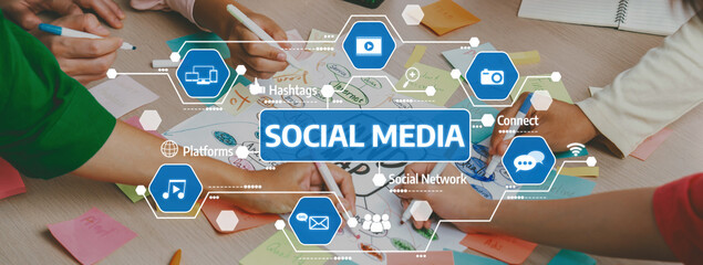 A dynamic workspace filled with hands engaged in a collaborative session focused on social media strategies, featuring colorful sticky notes and digital icons that symbolize connection. Amity