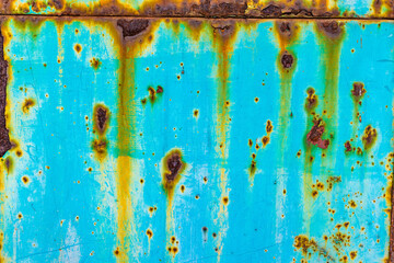 Aqua metal with rust drips and spots