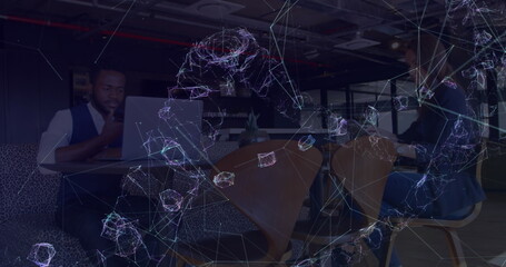 Image of networks of connections and dna structure over people using electronic devices