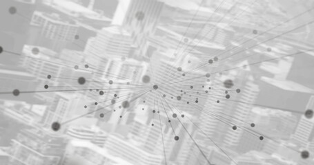 Image of networks of connections with grey spot with cityscape in background