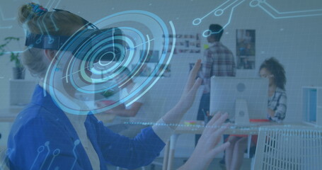 Image of scope scanning and processor elements over businesswoman wearing vr headset