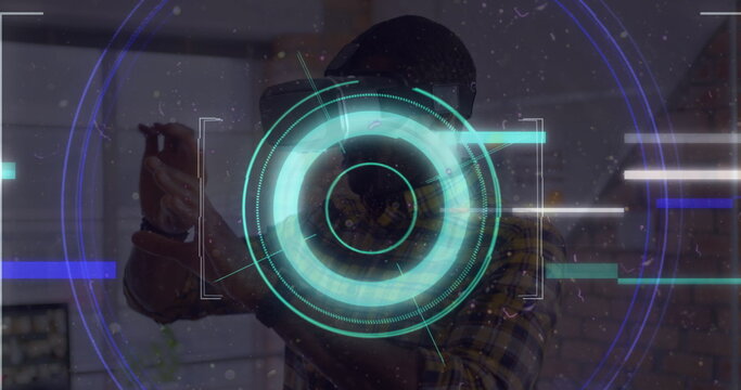 Light trails over neon scope scanner against african american man gesturing while wearing vr headset