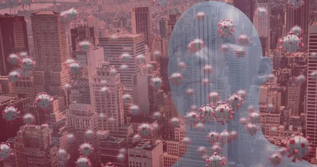 Selbstklebende Fototapeten Image of covid 19 cells floating over human head and cityscape on red background © vectorfusionart