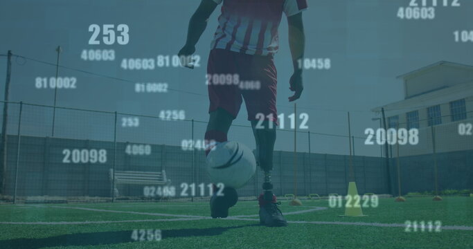 Multiple changing numbers against male soccer player juggling the ball on grass field
