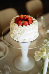 White Cake with Strawberries on Glass Stand