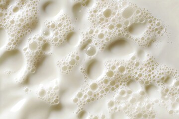 Creamy milk surface with frothy bubbles
