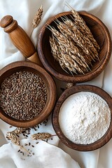 Wooden bowls of grains & flour on fabric