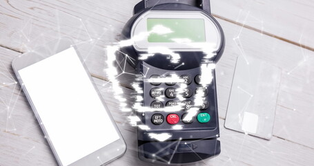 Image of network of connections and security padlock on shield over payment terminal