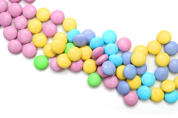 Closeup of colorful chocolate candies on white 