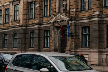 An elegant historic building with classical architecture, featuring decorative columns, arched...