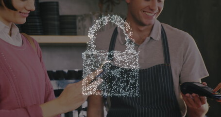 Image of network security padlock over people using payment terminal