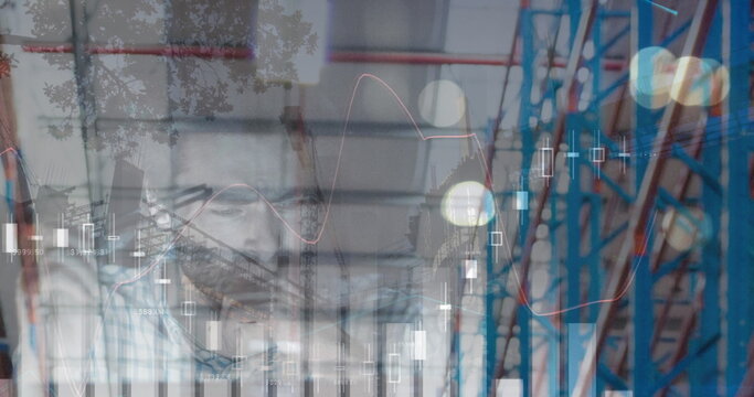 Image of financial data processing over businessman and warehouse - Powered by Adobe