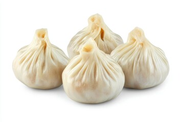 Obraz premium Four Delicious Steamed Dumplings Isolated on White Background in Close-up