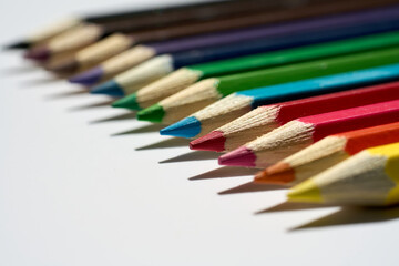 A set of colorful pencils ready to use. Macro photography. School, office or graphic design materials.