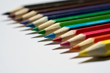 A set of colorful pencils ready to use. Macro photography. School, office or graphic design materials.