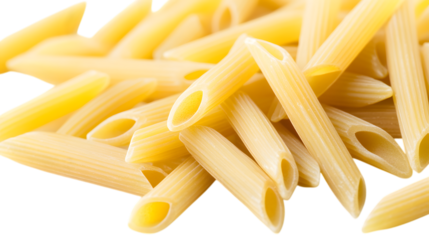 Uncooked penne pasta pieces scattered on a white background
