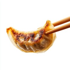 Crispy golden-brown dumpling held by chopsticks
