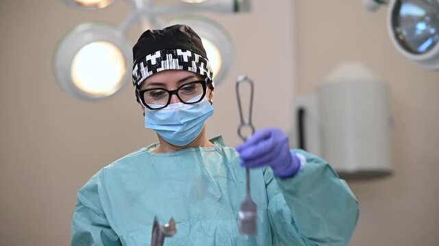 hysteroscopy operation. A cesarean operation is performed by a surgeon dressed in protective clothing