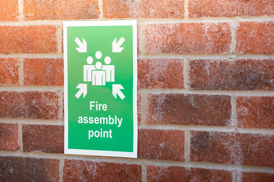 Fire assembly point. Safe area outside a building where people should gather after evacuating in the event of a fire.