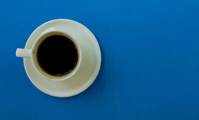 Cup of coffee on a blue background.