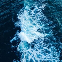 Fototapeta premium Spectacular aerial top view background photo of ocean sea water white wave splashing in the deep sea. Drone photo backdrop of sea wave in bird eye waves.