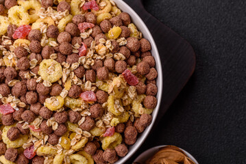 Flakes, chocolate balls and dried fruit for a hearty breakfast