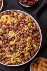 Flakes, chocolate balls and dried fruit for a hearty breakfast