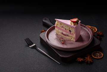 A slice of pink colored puff cake for a birthday celebration