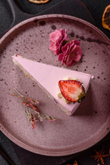 A slice of pink colored puff cake for a birthday celebration