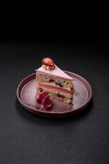 A slice of pink colored puff cake for a birthday celebration