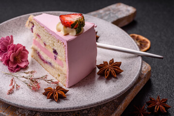 A slice of pink colored puff cake for a birthday celebration
