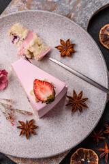 A slice of pink colored puff cake for a birthday celebration
