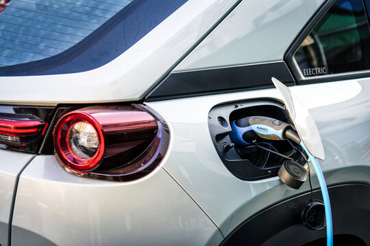 Mazda MX-30 Model Electric Vehicle Charging, SUV EV Charger, Electric Car Mennekes Connector, Zero Emission Vehicle Charging Module, West London, England, United Kingdom, April 2025