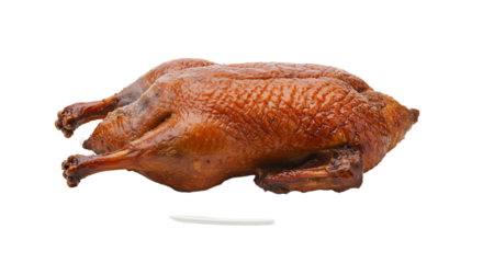 Golden roasted whole chicken on white plate with juicy skin and crisp appearance