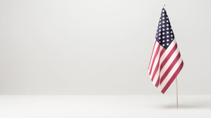 single american flag stands solemnly against pristine white backdrop with abundant copy space