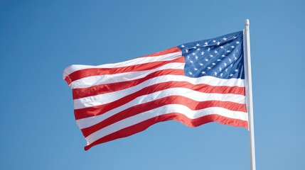 Obraz premium american flag gently waving in breeze against clear blue sky perfect for memorial day themes