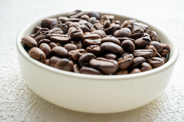 moistened local cultural coffee beans on a rotating background in close-up