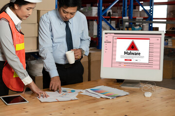 Cyber attacking concept. Malware alert showing on computer screen display scam and threat detection on computer system or online server to be removed snugly.