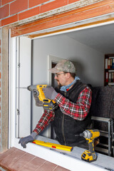 Construction Worker Installing Window Frame with Cordless Power Drill – Home Renovation Scene
