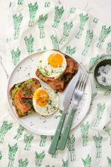 Avocado, Smoked Salmon and Fried Egg Toast for Breakfast for breakfast  .Healthy appetizer.