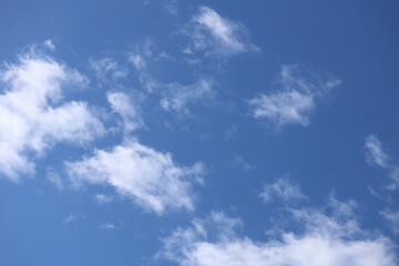 White clouds in a blue bright sky.