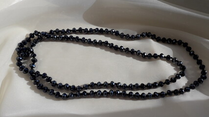 Black crystal, glass necklaces, beads. Vintage jewelry. Vintage background.